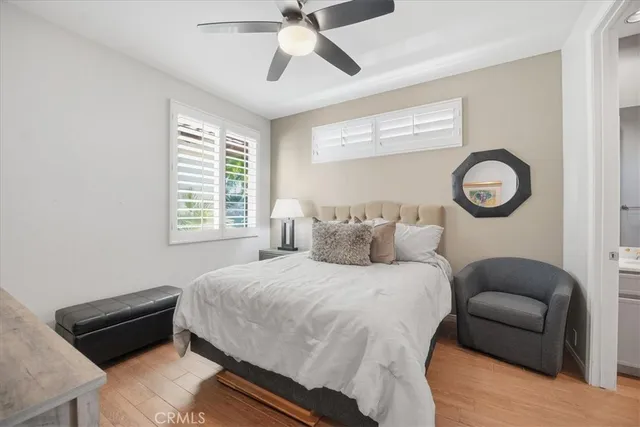 a bedroom with bed furniture and a window