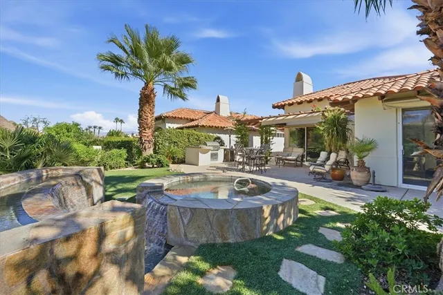 an aerial view of a golf course with parking space