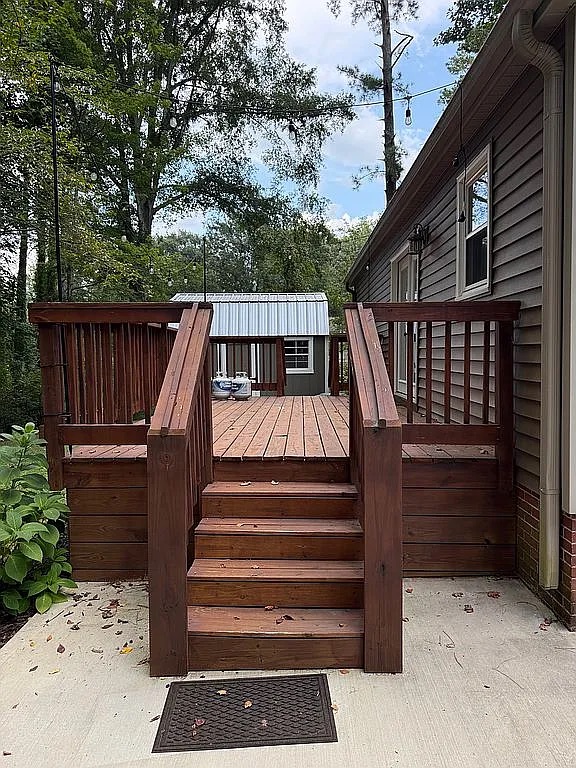 315 Rock Creek Road Clemson, SC 29631 - Photo 16 of 18 Stairs lead up to a spacious wooden deck bordering the back of the home.