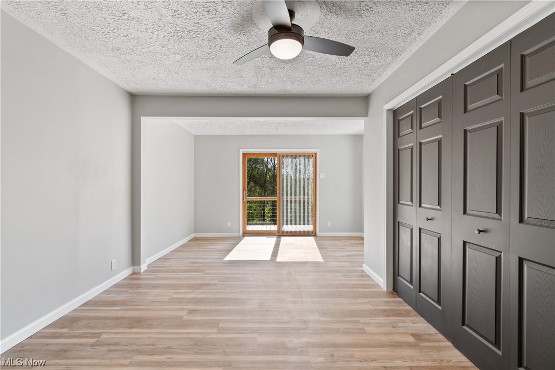 59636 Broadview Road Shadyside, OH 43947 - Photo 18 of 31 Hardwood floored empty room with a textured ceiling and ceiling fan
