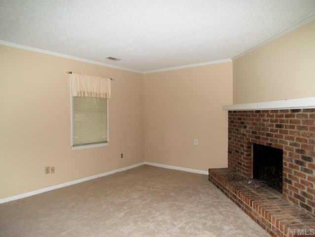 5572 Hamstead Crossing Raleigh, NC 27612 - Photo 2 of 8 a view of empty room with fireplace