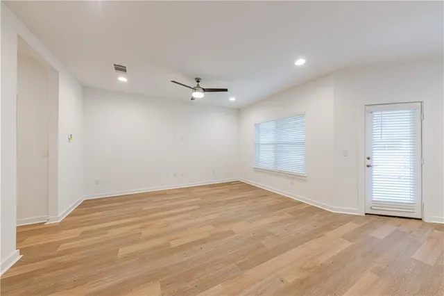 a kitchen with a sink and chandelier