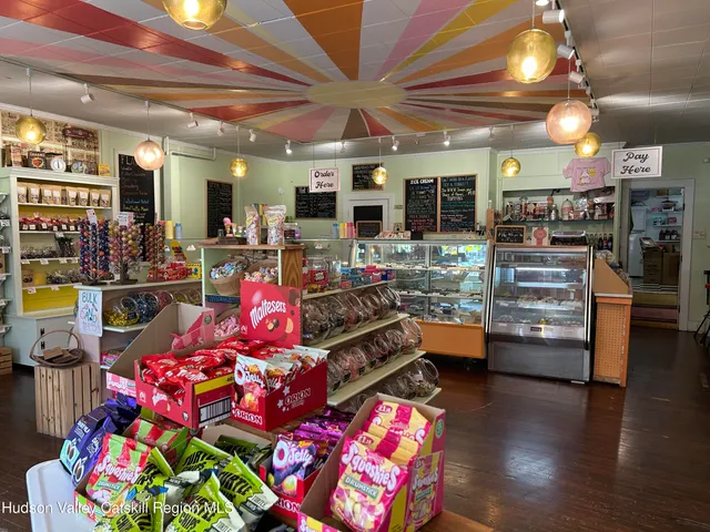 a room with lots of different furniture and a flat screen tv