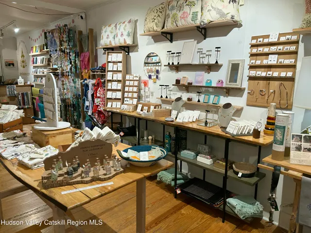 a room with stainless steel appliances kitchen island granite countertop furniture and a kitchen view