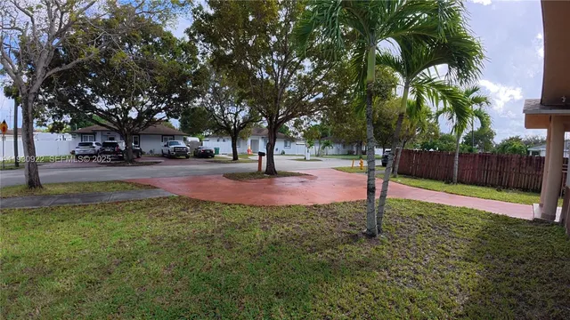 a view of a backyard with sitting area and furniture