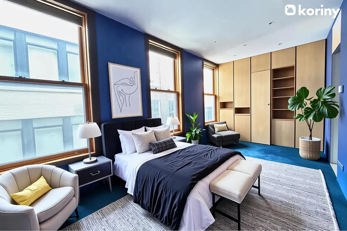 75 Warren Street Brooklyn, NY 11201 - Photo 22 of 39 a bedroom with a bed and a couch