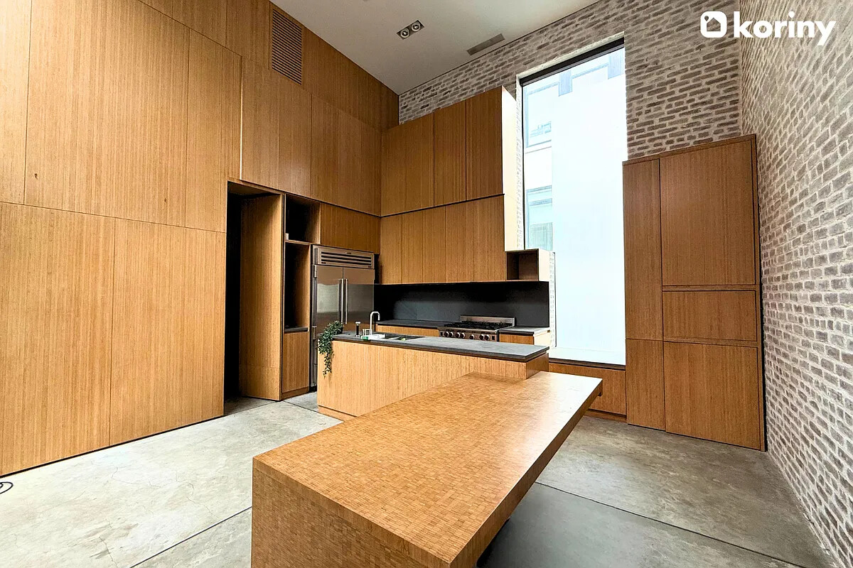 75 Warren Street Brooklyn, NY 11201 - Photo 28 of 39 a kitchen with stainless steel appliances granite countertop a refrigerator a stove and a sink with wooden floor