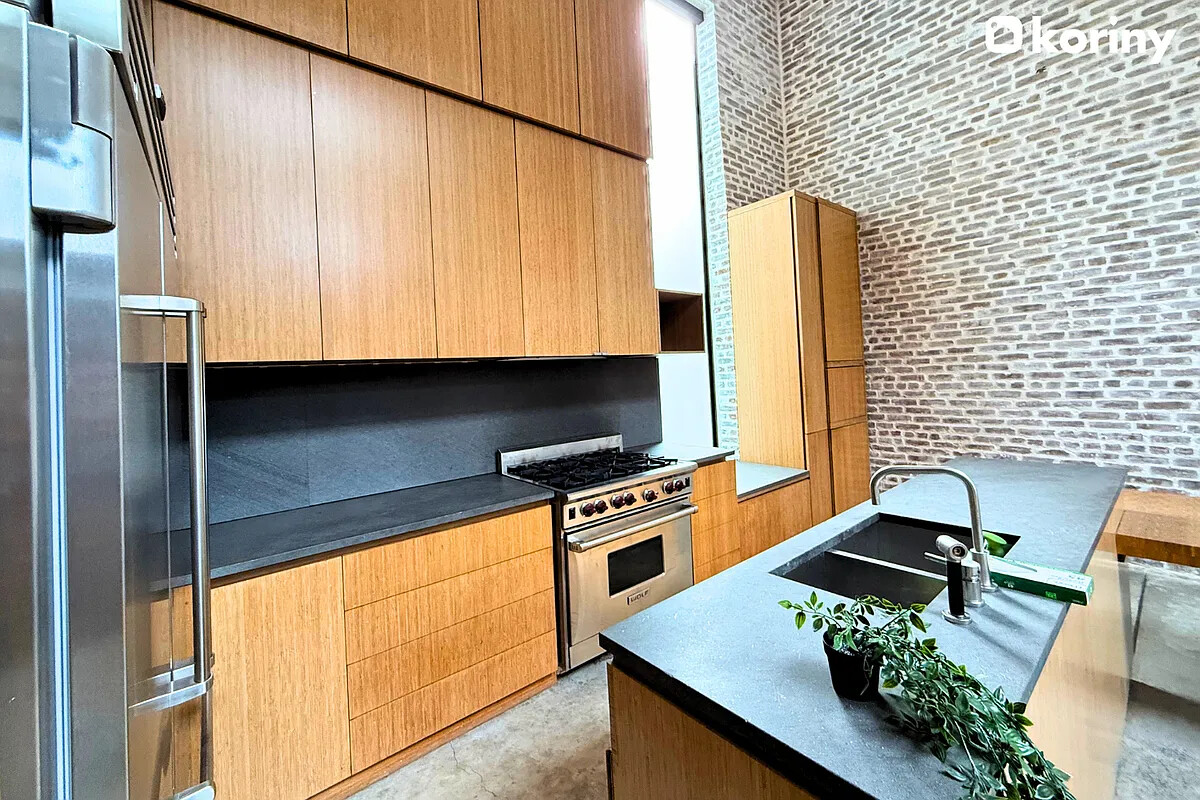 75 Warren Street Brooklyn, NY 11201 - Photo 29 of 39 a kitchen with a sink appliances and cabinets