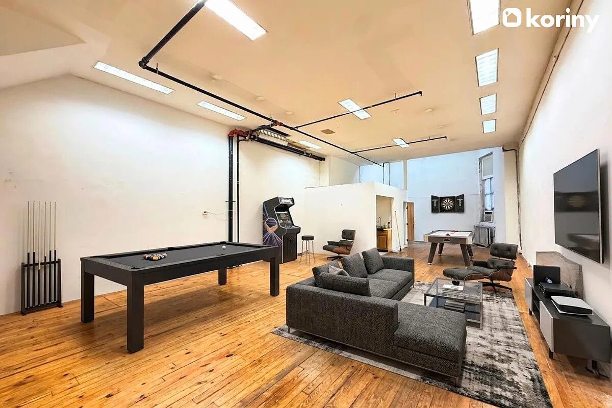 75 Warren Street Brooklyn, NY 11201 - Photo 3 of 39 a living room with furniture and a flat screen tv