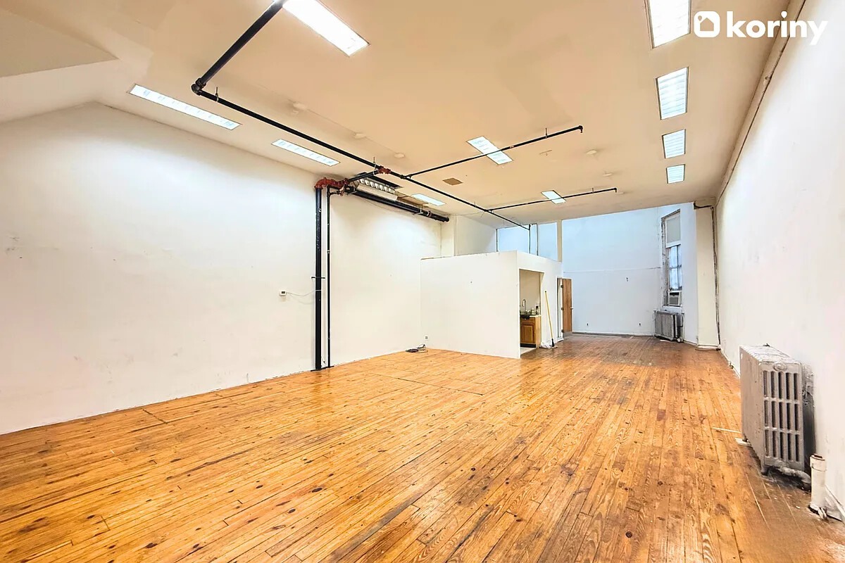 75 Warren Street Brooklyn, NY 11201 - Photo 4 of 39 a view of empty room with wooden floor