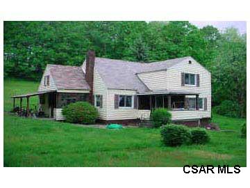 397 Grange Hall Road Seward, PA 15954 - Photo 1 of 1 a black and white house with a yard