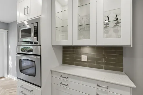 a kitchen with appliances and cabinets