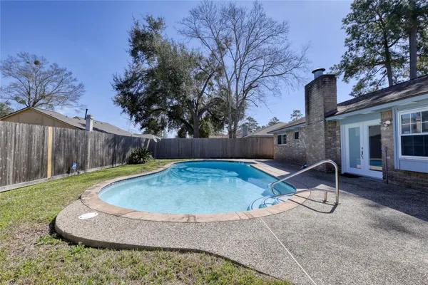 a backyard of house with yard barbeque oven and outdoor seating