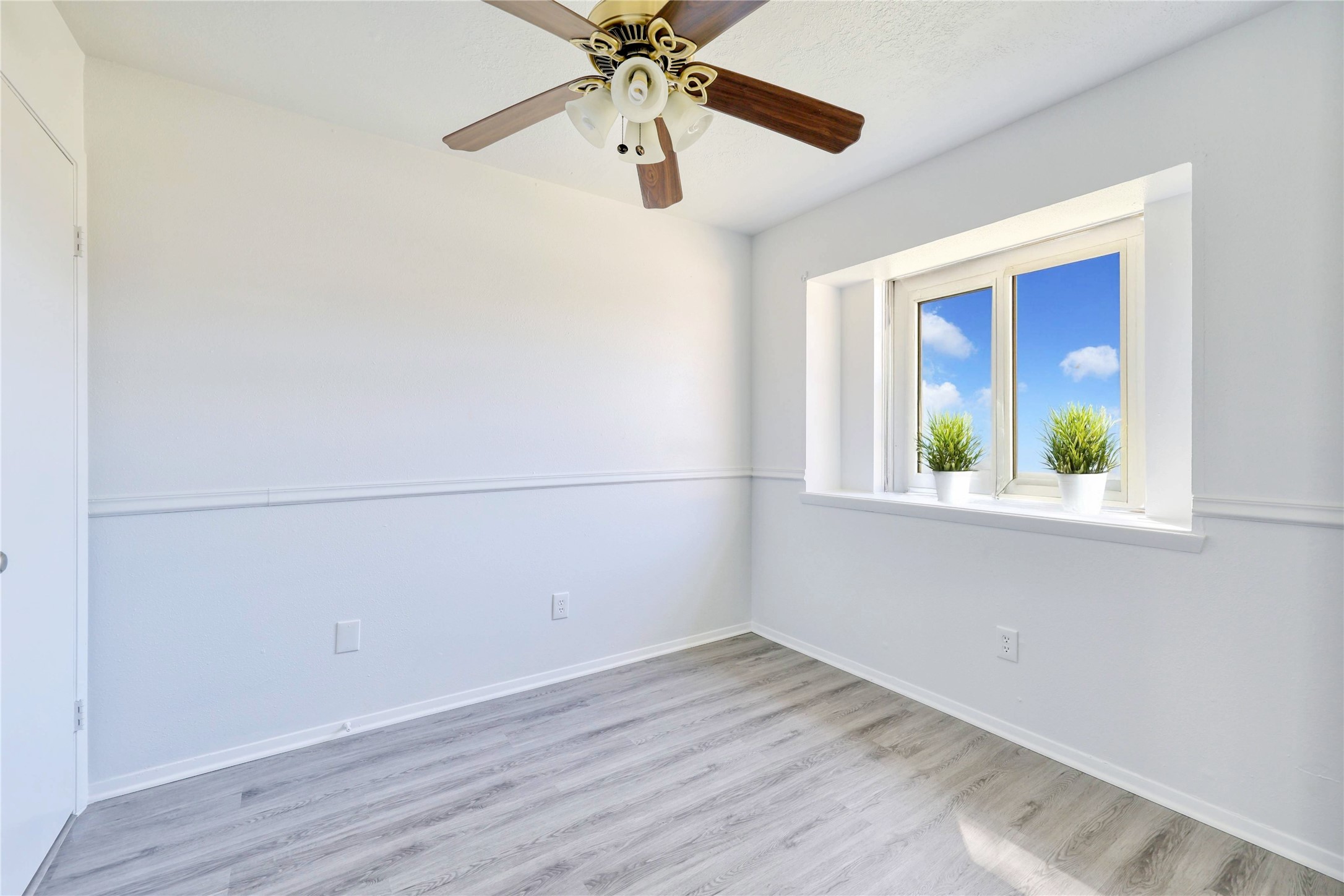 3610 Acorn Springs Lane Spring, TX 77389 - Photo 5 of 11 an empty room with a window and a ceiling fan