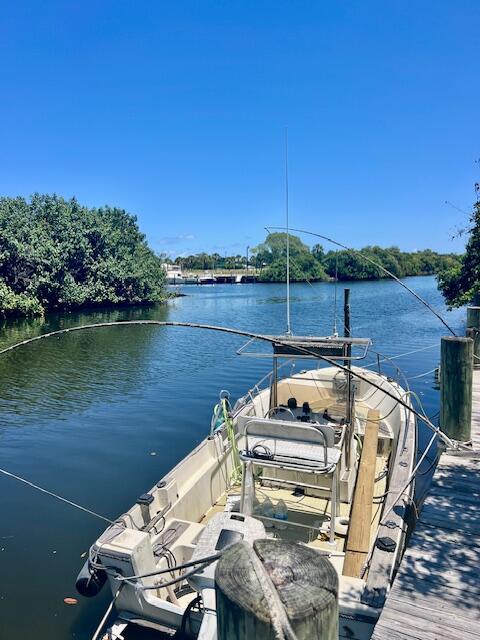 727 Hummingbird Way, Unit 1 North Palm Beach, FL 33408 - Photo 13 of 13 a view of a lake from a balcony with outdoor space