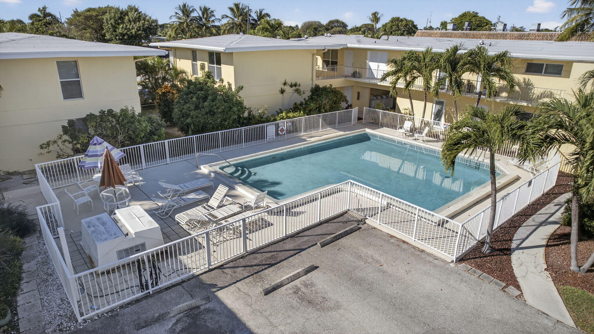727 Hummingbird Way, Unit 1 North Palm Beach, FL 33408 - Photo 8 of 13 a view of house with outdoor seating
