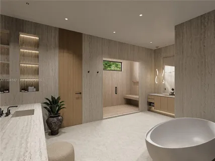 a bathroom with a tub a mirror and a sink