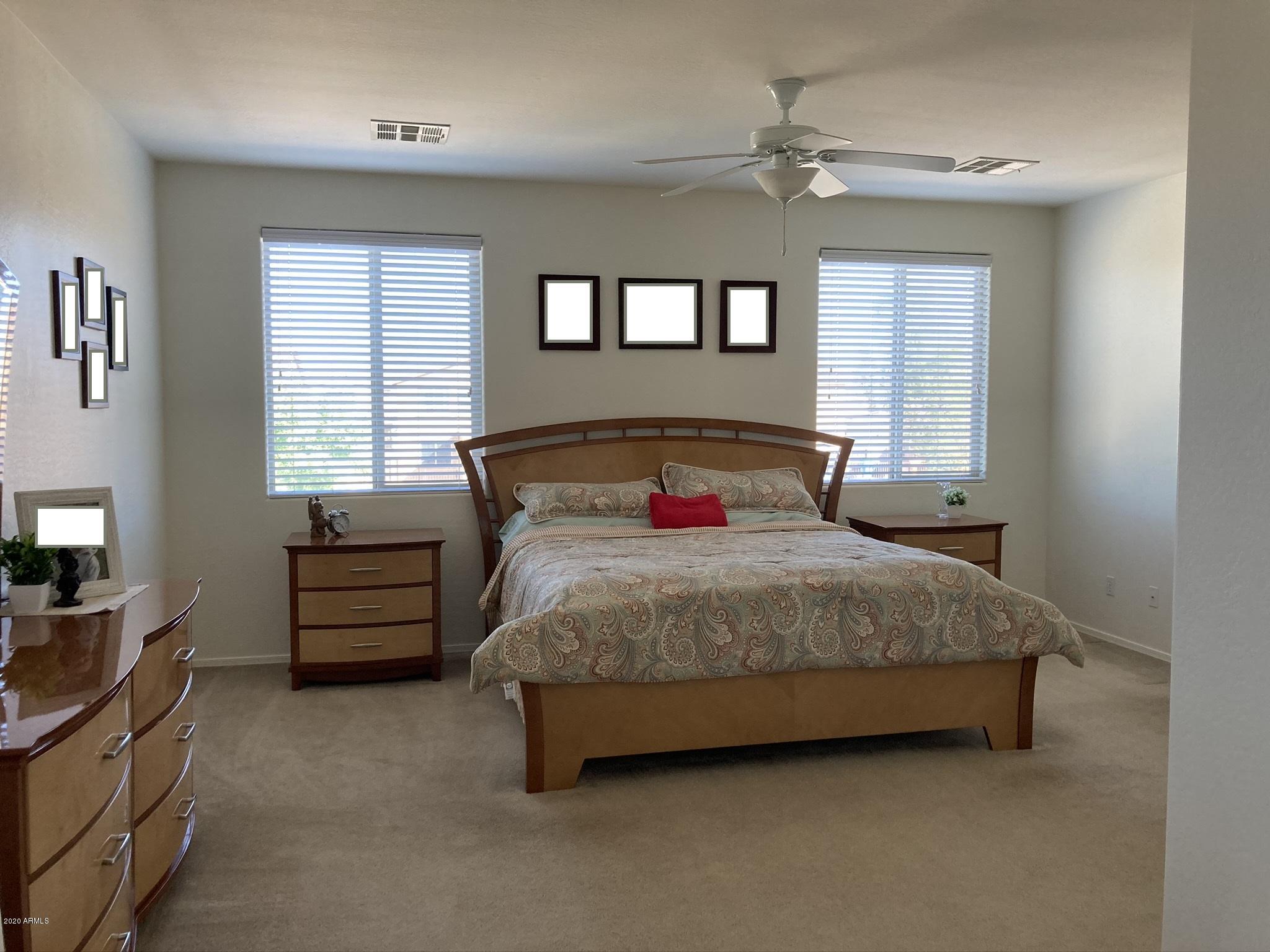 7342 West Carter Road Laveen, AZ 85339 - Photo 11 of 18 a bedroom with a bed and furniture