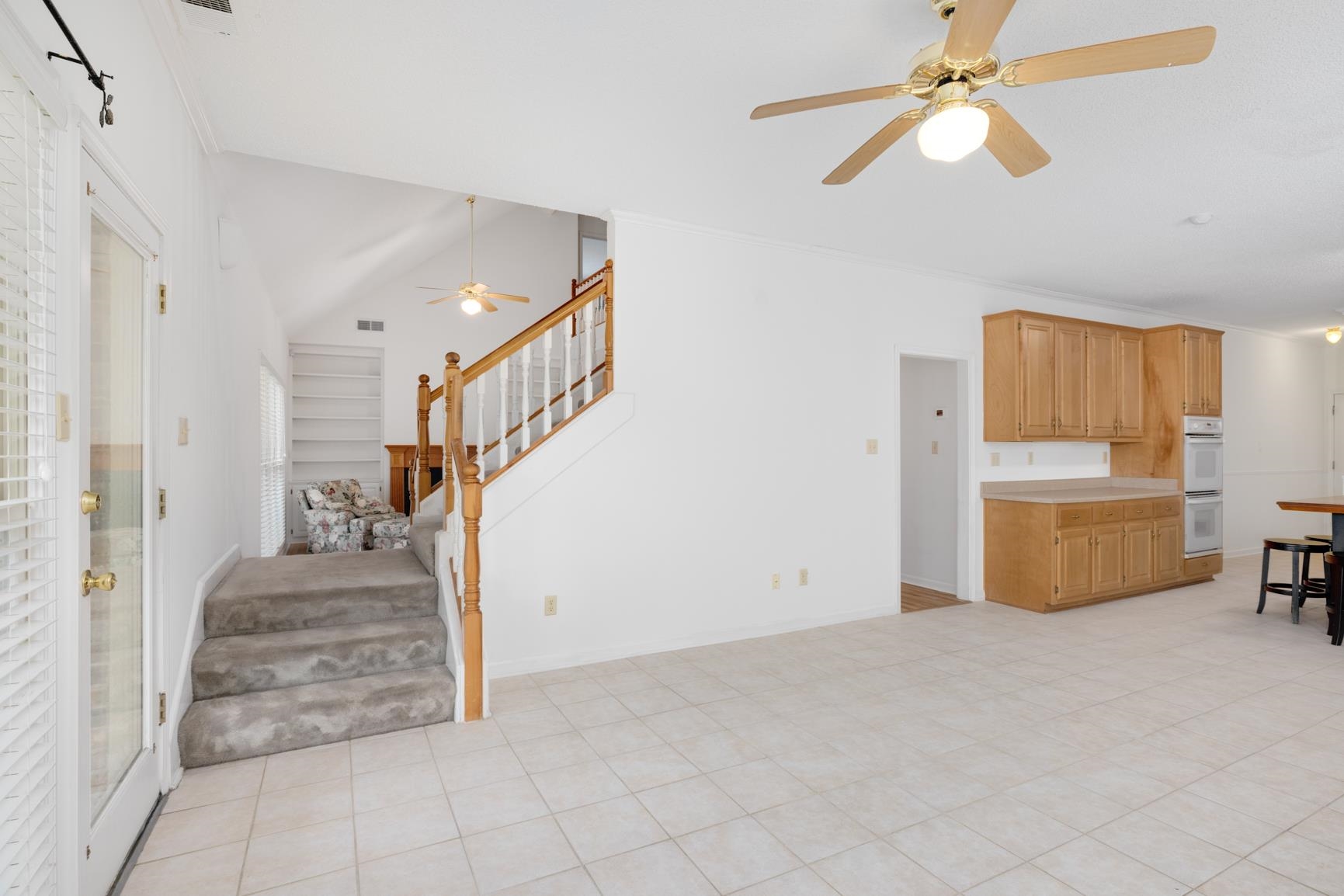 9015 Raspberry Lane Cordova, TN 38016 - Photo 20 of 40 Tiled living room featuring a barn door, lofted ceiling, and ornamental molding