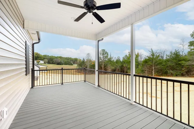 a view of a kitchen with wooden floor and a sink