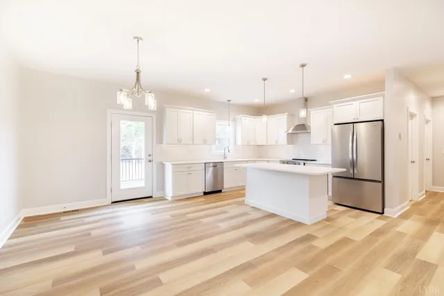 a view of an empty room with a fireplace