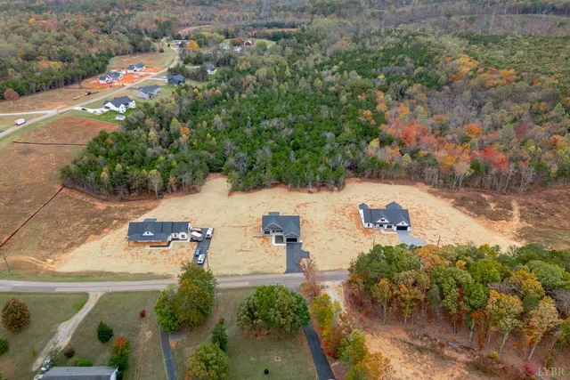 a view of a house with snow on the road