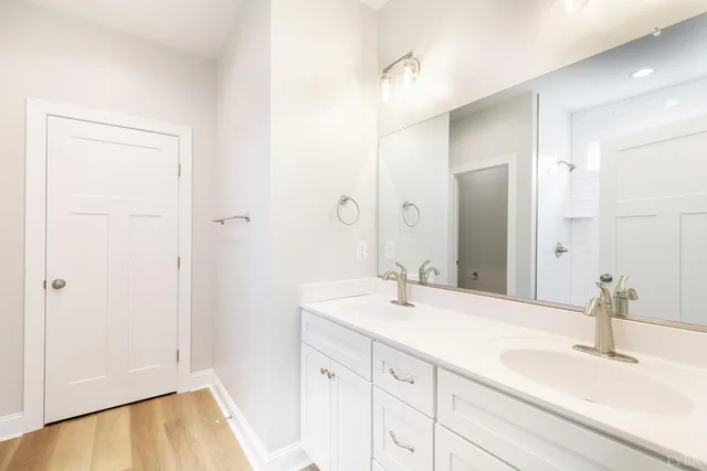 an empty room with fan and windows