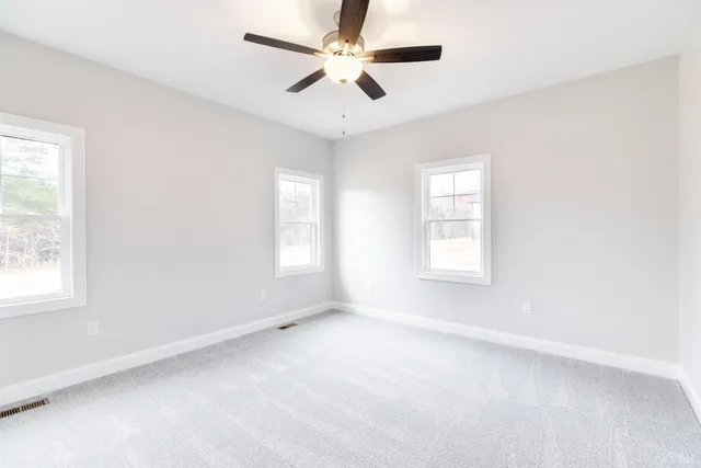 a view of a balcony with wooden floor