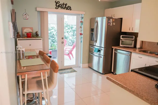 a room with furniture a rug and gym equipment