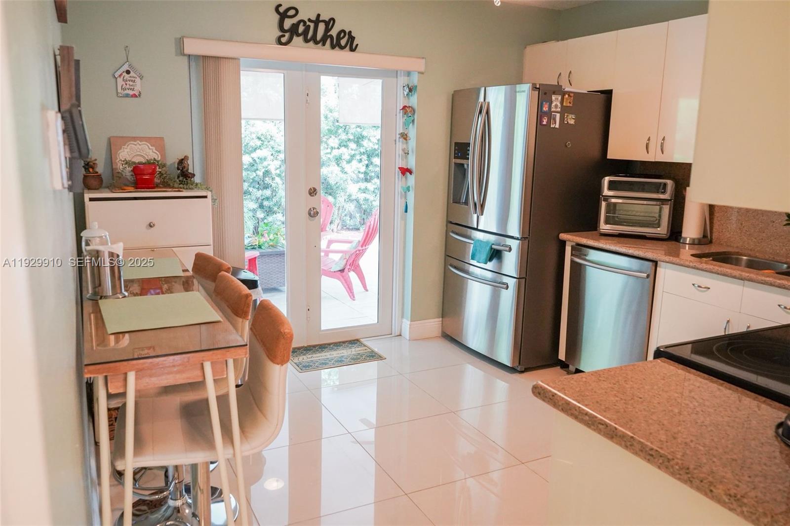 19907 Northwest 67th Court Hialeah, FL 33015 - Photo 18 of 53 a room with stainless steel appliances a refrigerator and a stove top oven