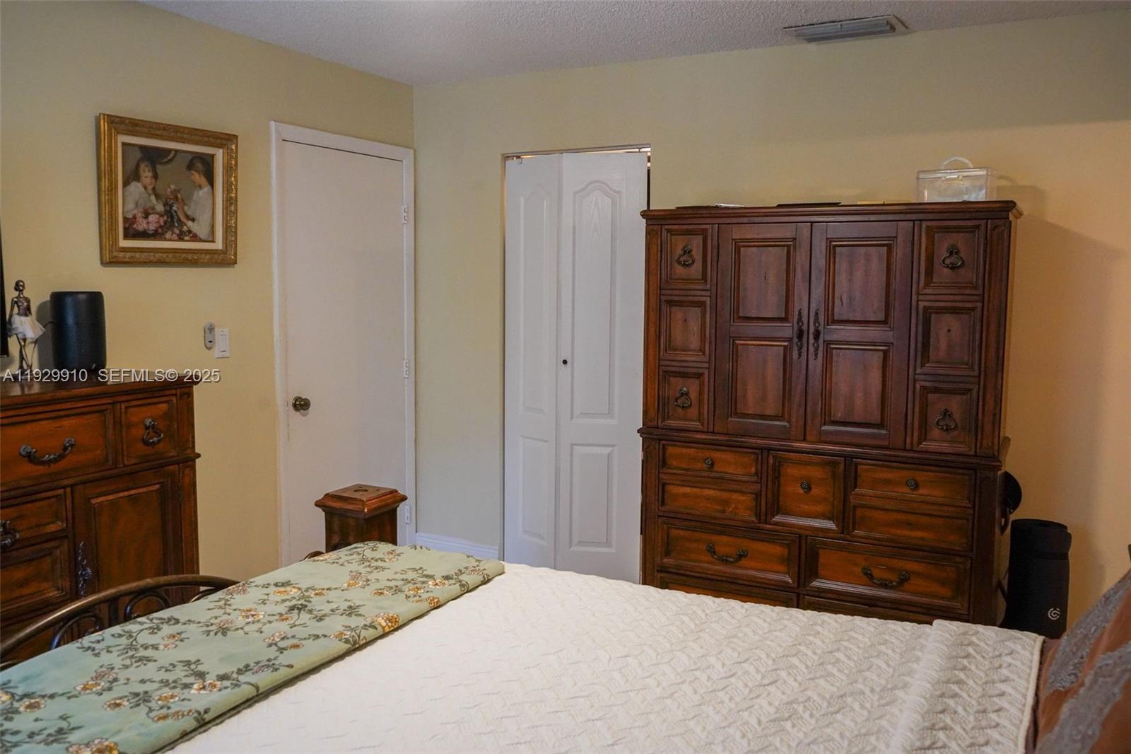 19907 Northwest 67th Court Hialeah, FL 33015 - Photo 23 of 53 a bedroom with a bed and furniture