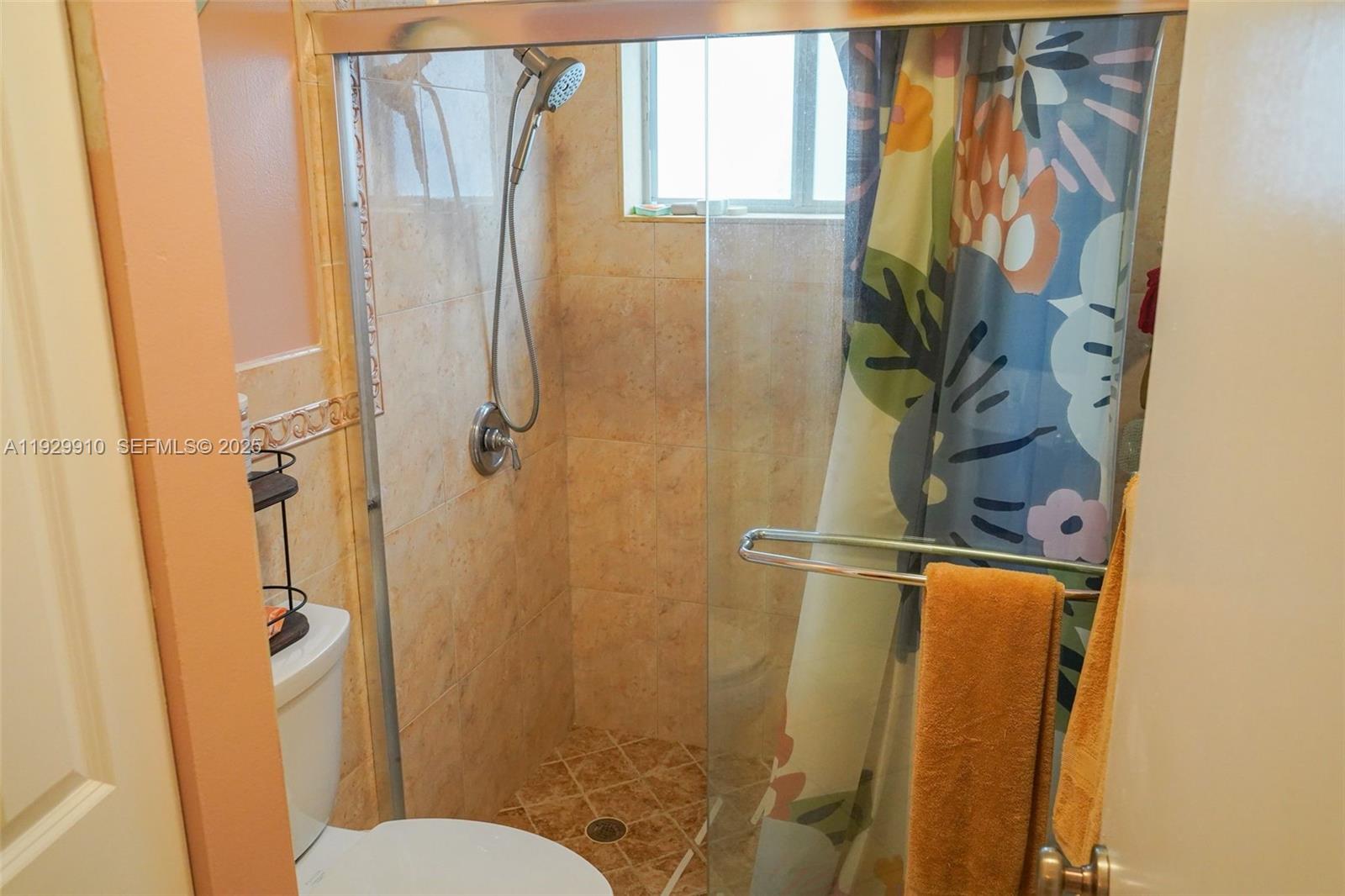 19907 Northwest 67th Court Hialeah, FL 33015 - Photo 31 of 53 a bathroom with a shower and toilet