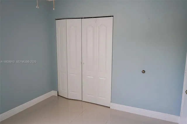 a bedroom with a bed and a cabinets