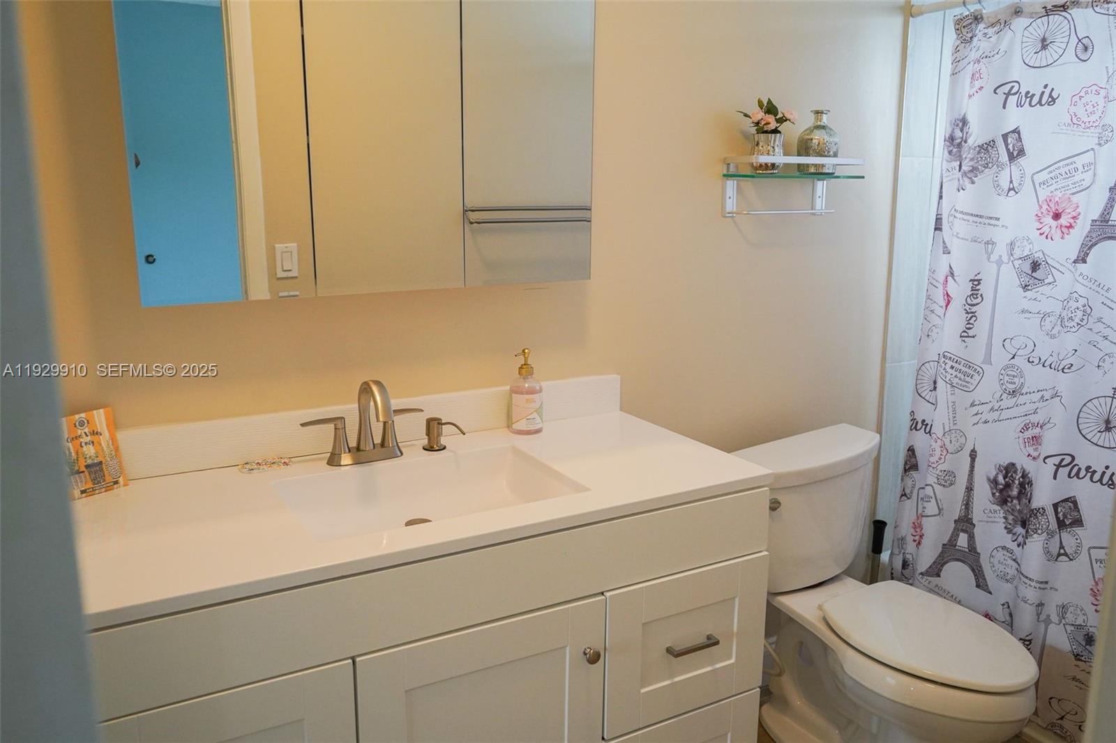 19907 Northwest 67th Court Hialeah, FL 33015 - Photo 37 of 53 a bathroom with a sink a toilet and a mirror