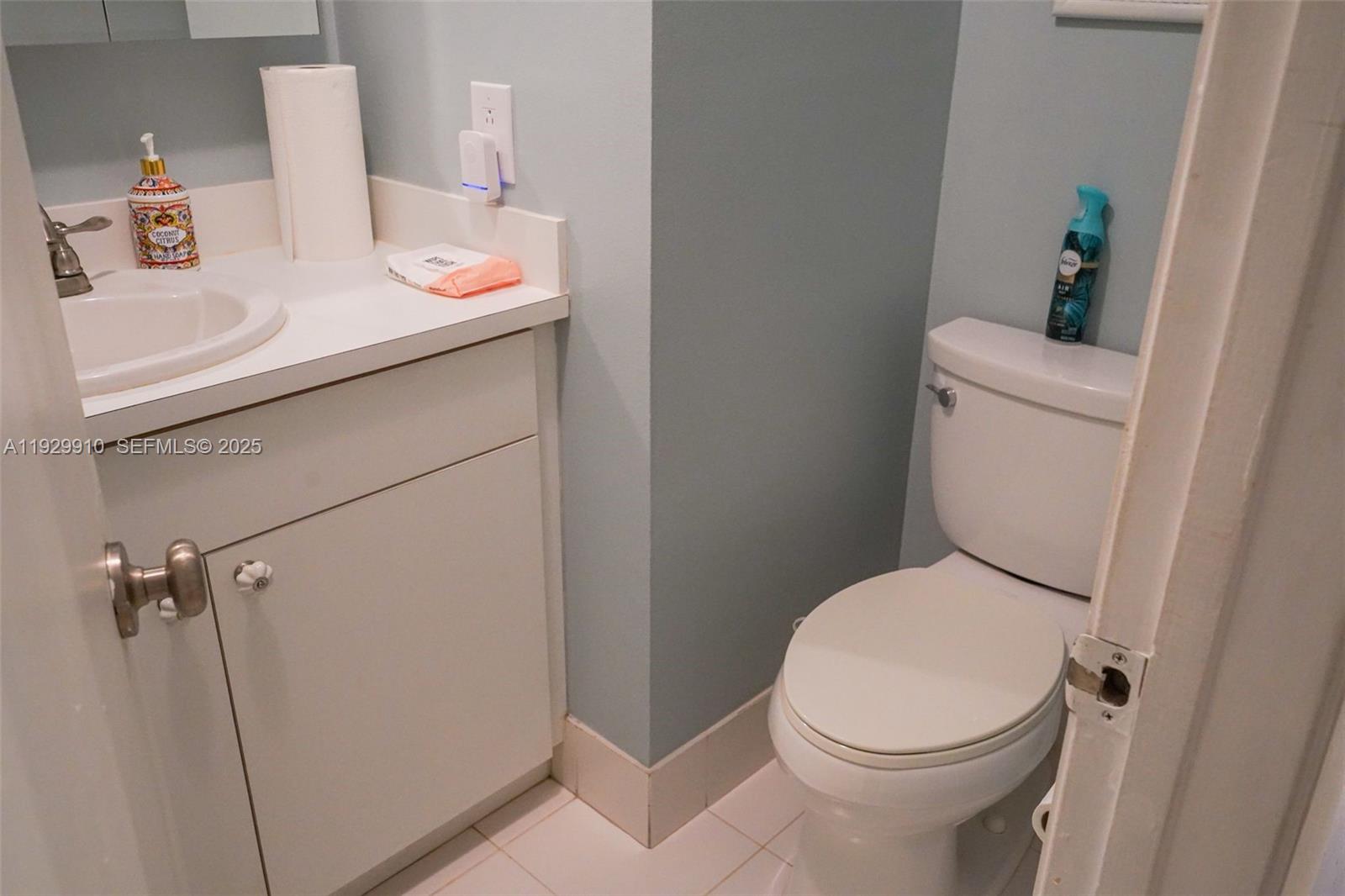 19907 Northwest 67th Court Hialeah, FL 33015 - Photo 39 of 53 a white toilet sitting next to a bathroom sink