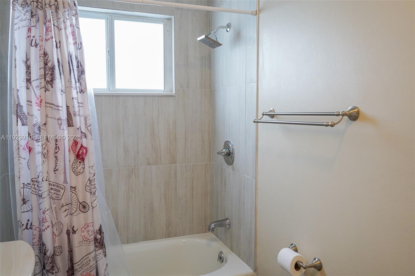 19907 Northwest 67th Court Hialeah, FL 33015 - Photo 40 of 53 a bathroom with a bathtub and shower