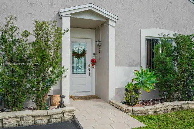 a front view of a house with trees