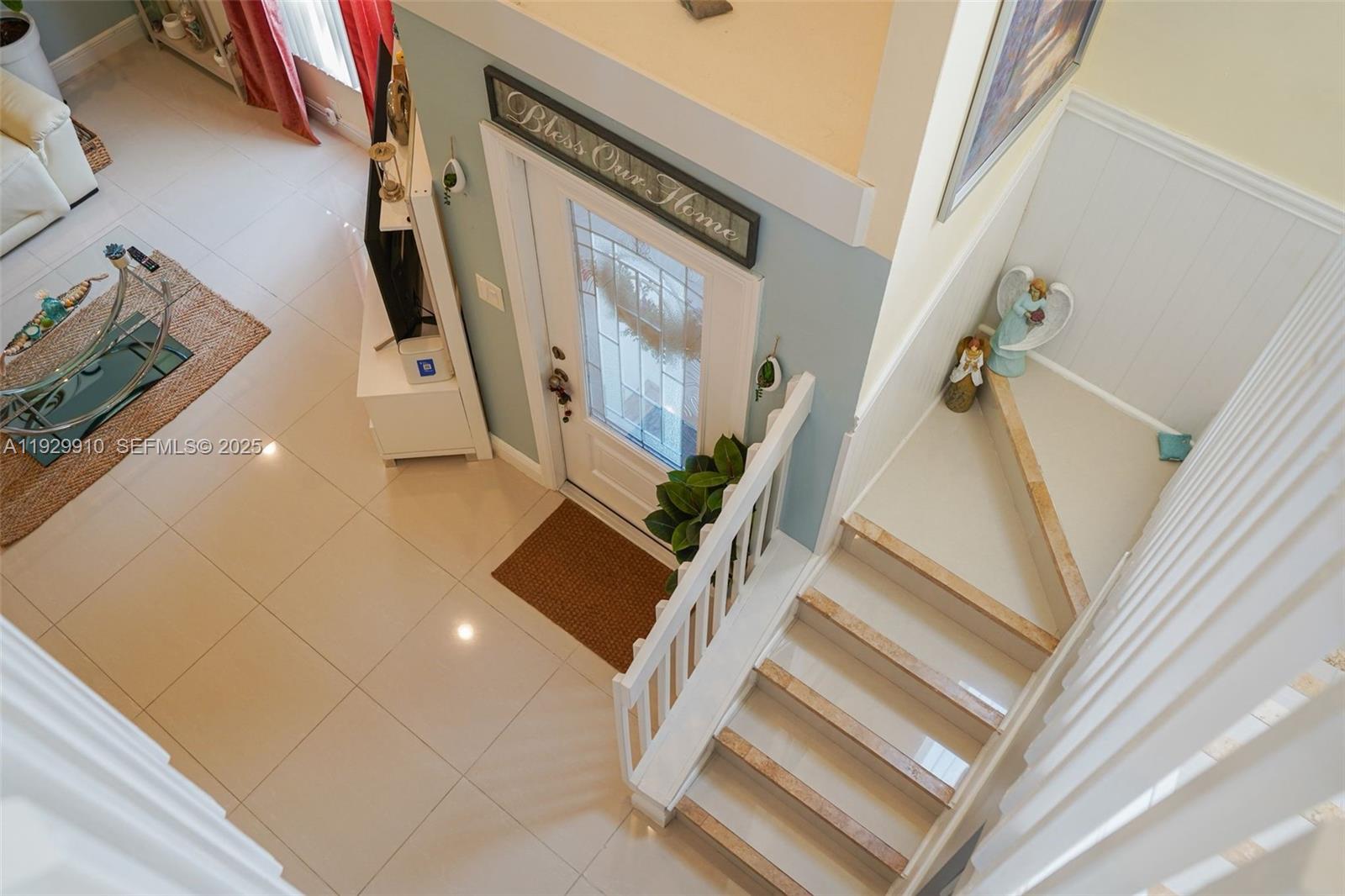 19907 Northwest 67th Court Hialeah, FL 33015 - Photo 41 of 53 a view of staircase with white walls and a window