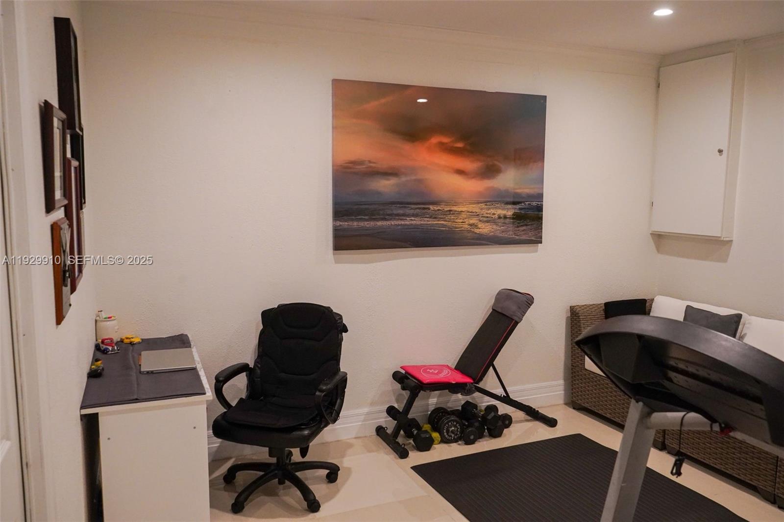 19907 Northwest 67th Court Hialeah, FL 33015 - Photo 42 of 53 a view of a workspace with furniture and a window