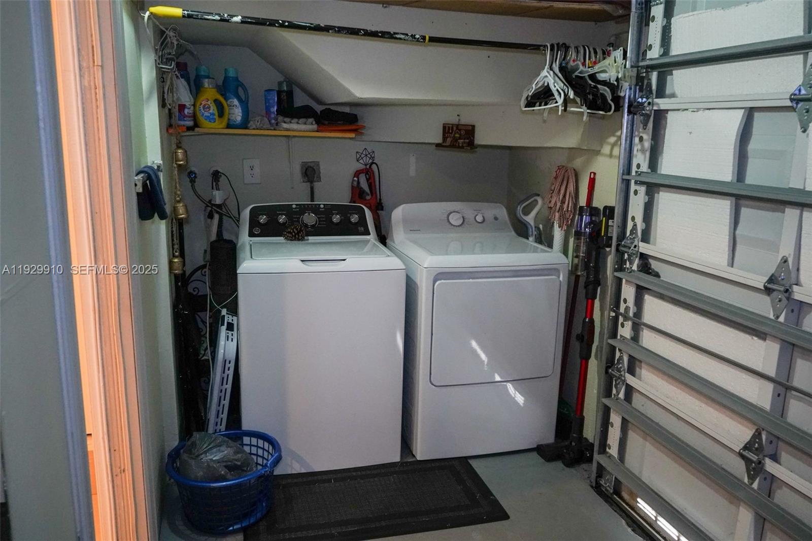 19907 Northwest 67th Court Hialeah, FL 33015 - Photo 46 of 53 a view of storage and utility room with washer and dryer