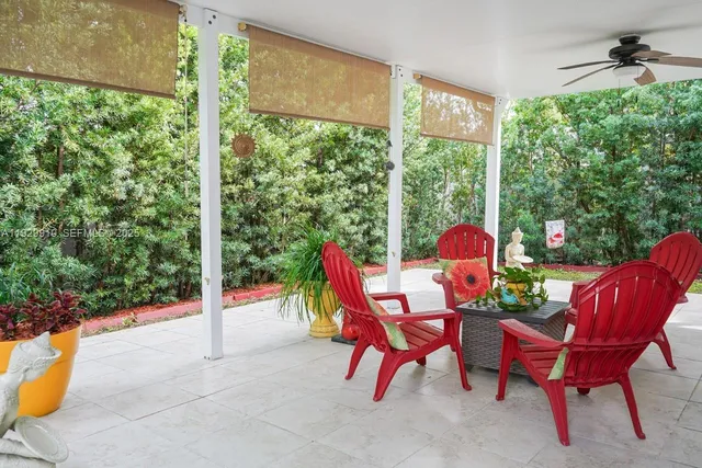 a view of a dining room with a table and chairs