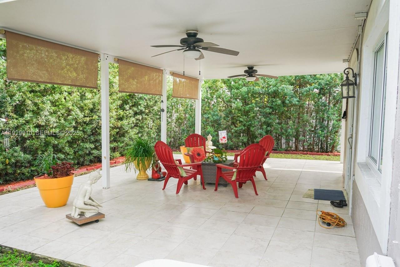 19907 Northwest 67th Court Hialeah, FL 33015 - Photo 50 of 53 a view of a dining room with a table and chairs