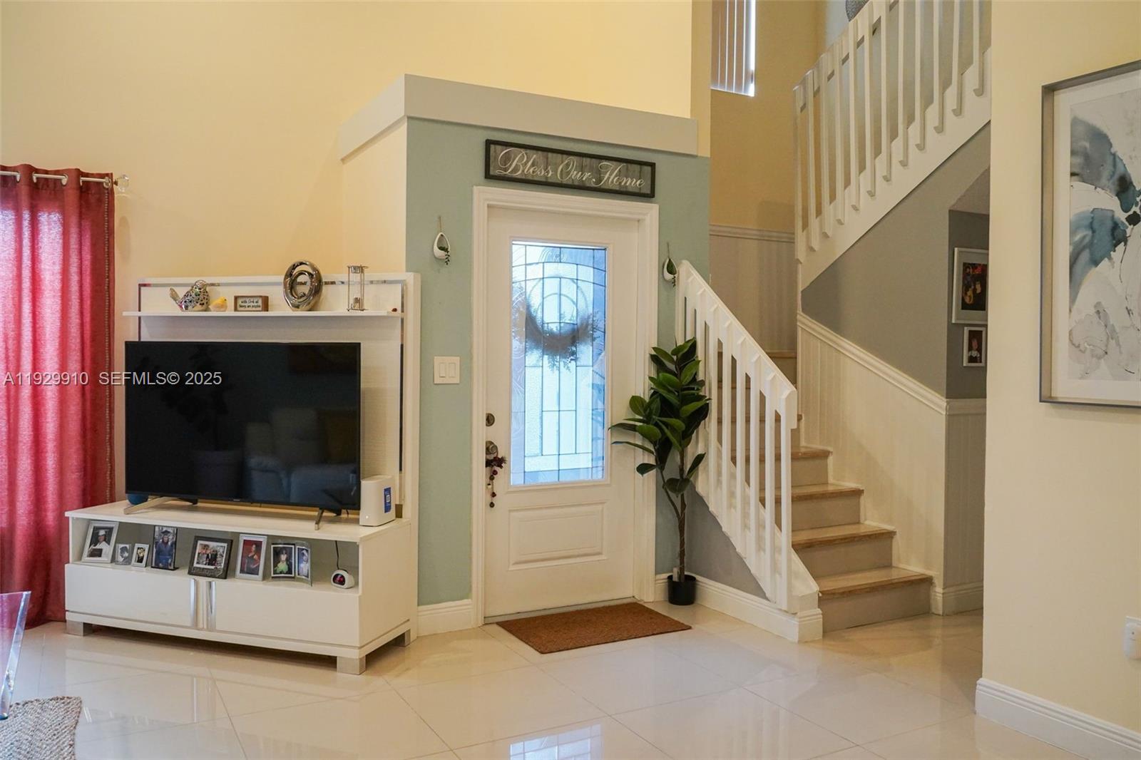 19907 Northwest 67th Court Hialeah, FL 33015 - Photo 5 of 53 a view of an entryway and livingroom with furniture