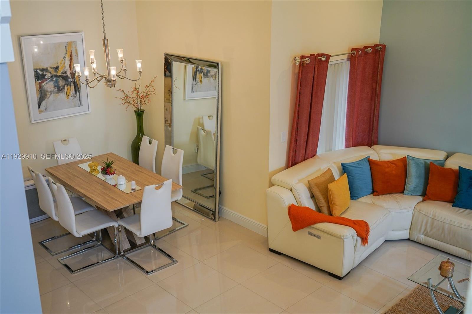 19907 Northwest 67th Court Hialeah, FL 33015 - Photo 9 of 53 a living room with furniture and a chandelier