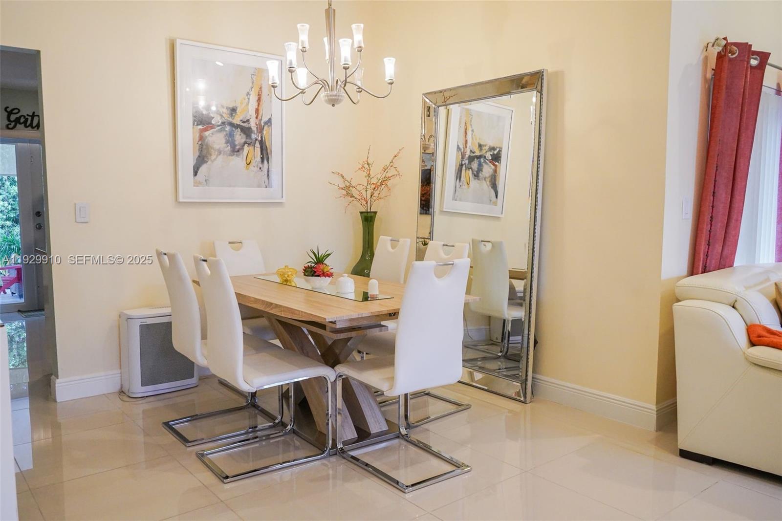 19907 Northwest 67th Court Hialeah, FL 33015 - Photo 10 of 53 a view of a dining room with furniture