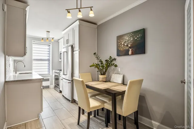 a dining room with furniture and window