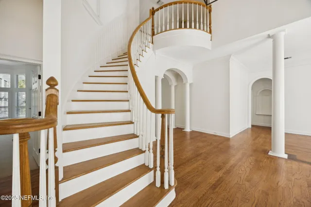 a bathroom with a tub a window and a shower