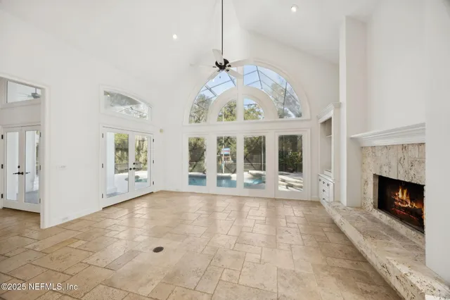 a view of an empty room with a ceiling fan
