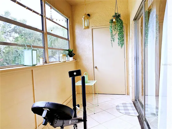 a front view of a house with a window and furniture