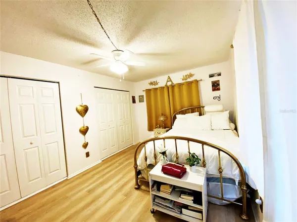 a bedroom with furniture and a window